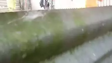Neighbor Bengali aunty bathing outdoor caught on camera
