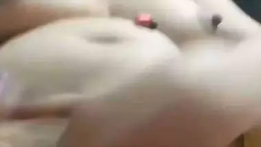 Chubby, young lady enjoys fingering her shaved pussy