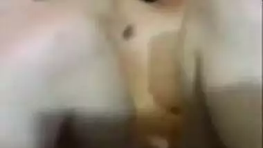 Mumbai MILF lying naked in bed with naughty...