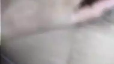 Desi girl nude on bed and fingering her hairy pussy